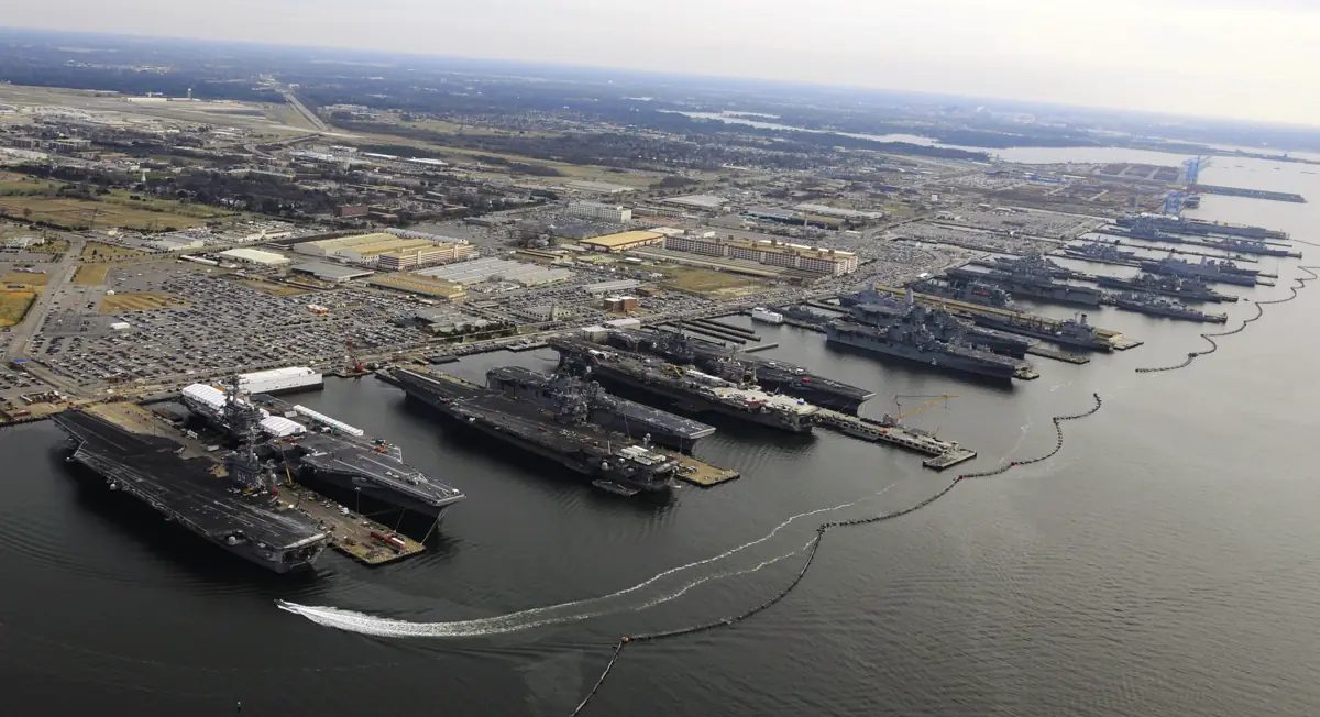 Aircraft carriers and amphibious ships moored at Naval Station Norfolk
